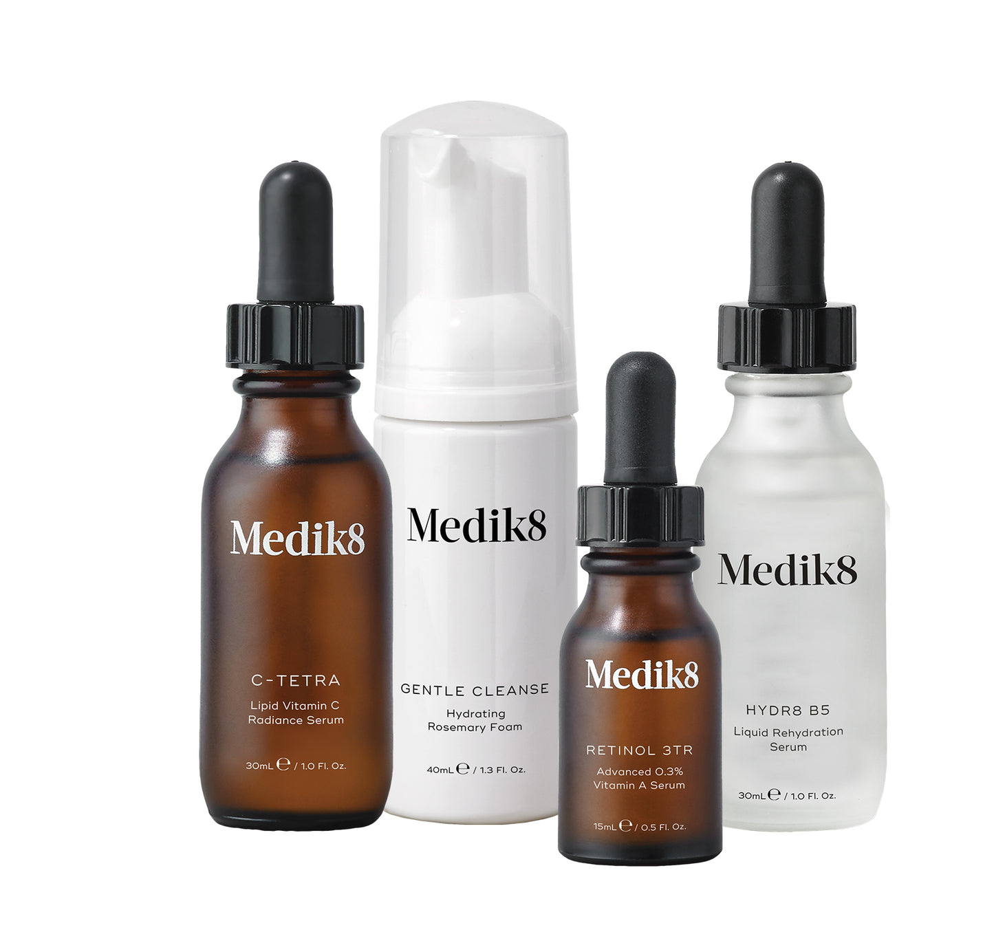 The Medik8 ABC Kit includes C-Tetra Serum in a 30ml amber bottle, Gentle Cleanse in a 40ml white pump bottle, Retinol 3TR in a 15ml dropper bottle, and Hydr8 B5 Serum in a 30ml clear dropper bottle