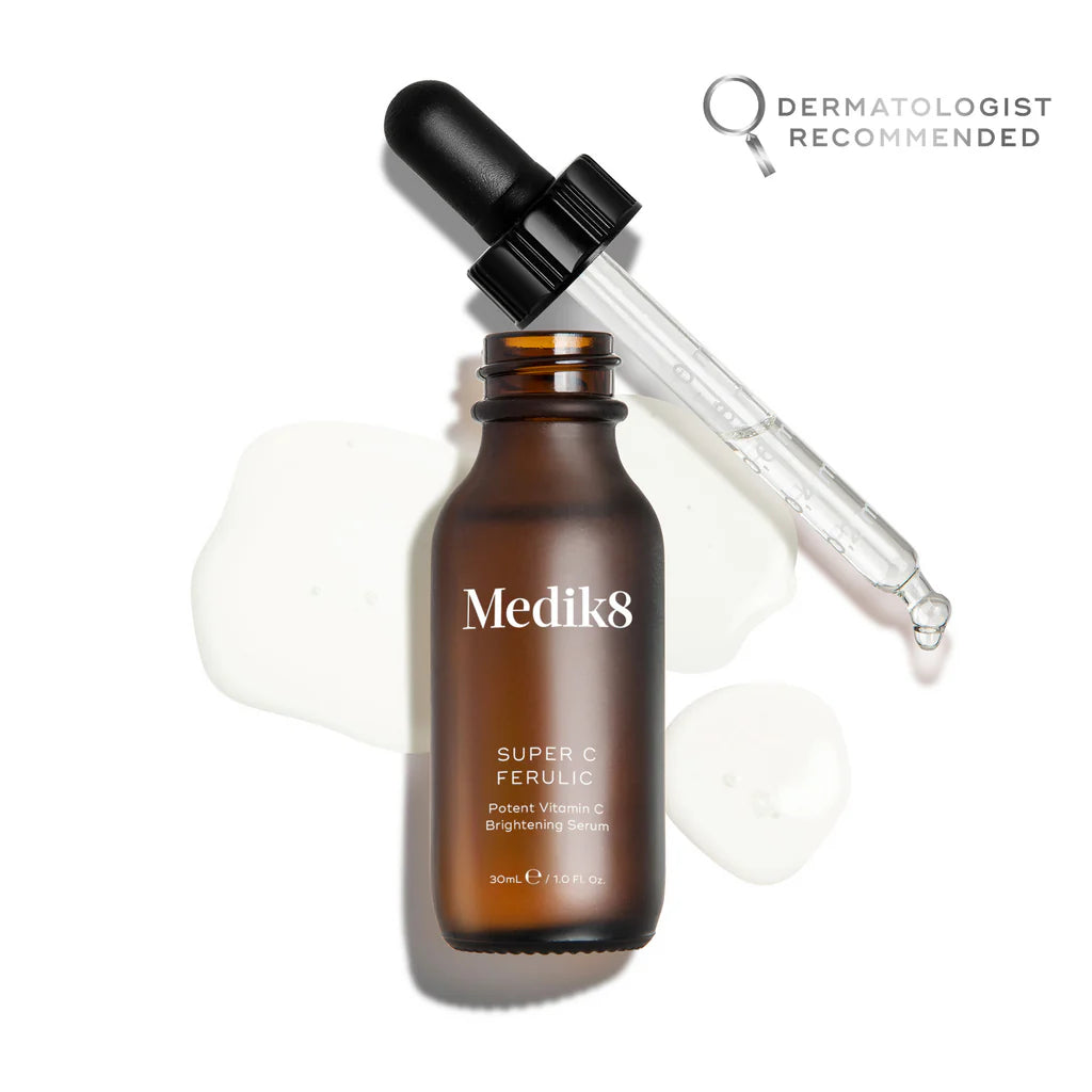 Medik8 Super C Ferulic 30ml: Amber glass dropper bottle with black cap containing high-strength vitamin C and ferulic acid serum; targets skin brightening and anti-aging.