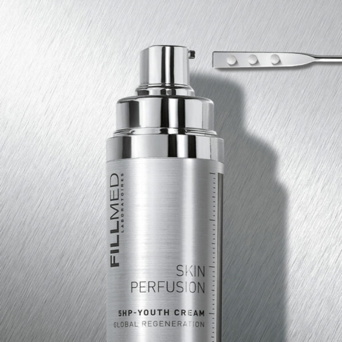 Fillmed 5HP youth cream in silver bottle with cream product swatch on silver spatula