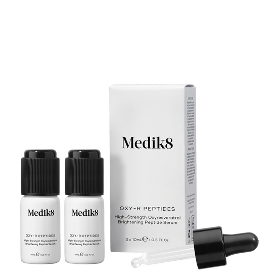 Medik8 Oxy-R Peptides, two 10ml frosted glass bottles with black  dropper caps, and white outer box; high-strength Oxyresveratrol brightening peptide serum. 